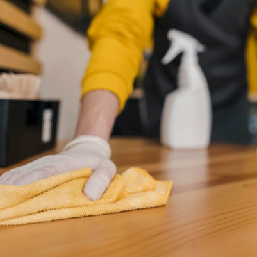 front-view-barista-cleaning-table_23-2148522935
