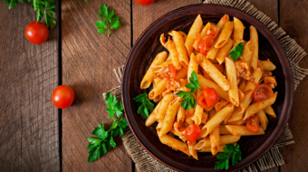 penne-pasta-tomato-sauce-with-chicken-tomatoes-wooden-table_2829-19744